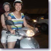 two women on motorbike head to big-c