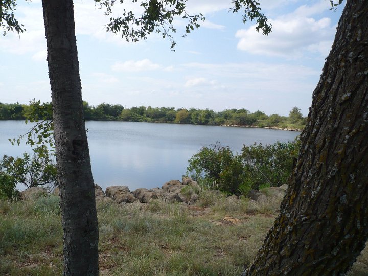 Beyond the main gatehouse of Fort Richardson State Park sits a mirror-surfaced lake, small, but beautiful. Shade trees over picnic tables offer a sun-guarded retreat. Fishing the Quarry Lake requires no license. The State keeps it stocked all year with catfish and keeper-sized bass. Trout join the year-around stockers from December through February.