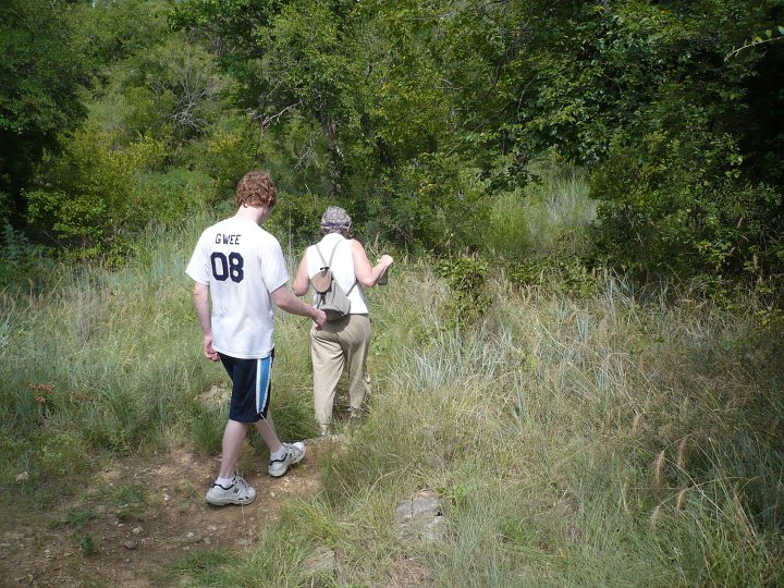 Large, rough, jagged rocks, plus spiders and—of course—the potential for rattlers and psycho cottonmouths, make closed toe shoes into foot-pleasing amenities when walking Rumbling Springs Path at Fort Richardson State Historic Park. As with the Magazine, fear not. No one gets snake bit at Fort Richardson. But this is no barefoot stroll in soft, cool morning sand. Stroll it is—almost—covering less than 200 yards or 183 meters on a path with zero stable footholds. Take your time. This sort-of-a-stroll is short and could give birth to perfect analogies about haste making waste.