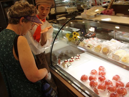 Kawaguchiko baker explains the filled peaches.