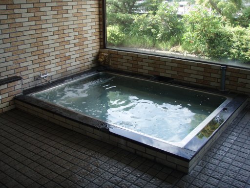 Soak bathe in mineral waters after showering at Kawaguchiko Station Inn.