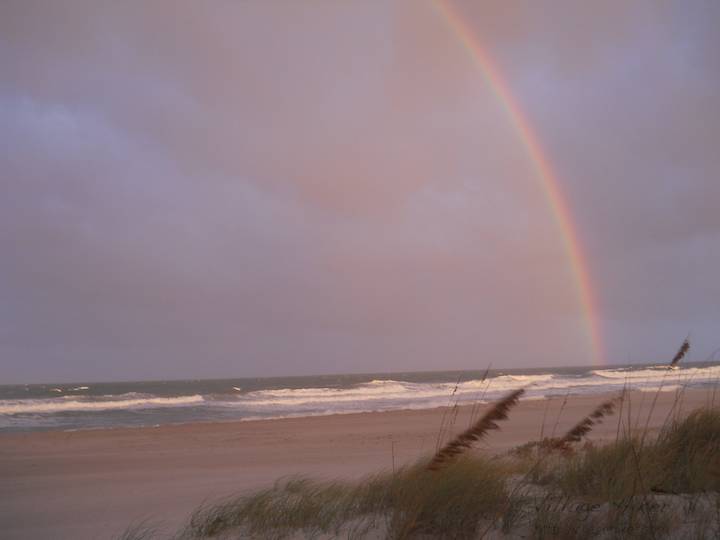A rainbow sinks into the sea during a sun-lighted sprinkle over the Atlantic Ocean at Melbourne Beach, Florida. Rainbows show off the entire color spectrum by refracting sun light into the sky. This rainbow lasted about 20 minutes. From the point of the photograph, the horizon was sightly more than three miles--just under five kilometers--distant. You make your own rainbow by spraying finely dispersed water into the air on a sunny day. Snapped with a Nikon Coolpix L22. Copyright 2010 by Village Hiker Publishing Company. All rights reserved. Please do not use without permission. Contact Village Hiker for digital reproduction and high-resolution prints.