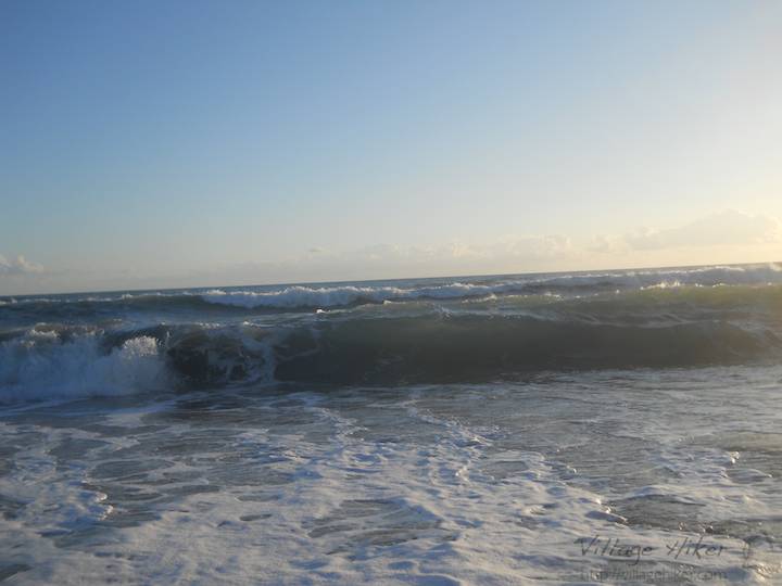 Looking out from the beach at sea level--just for fun, try to achieve a consensus definition of sea level--make it a goal to raise the camera higher just after taking the shot of the incoming surf. Because the ocean is like junior high--expect the unexpected--this sometimes fails. While this photo is sort of cool, check out the next one. Together, they capture the surf as the surf captures the camera on the beach at Melbourne Beach, Florida. The next one also explains how to recover the camera. Snapped with a Nikon Coolpix L22. Copyright 2010 by Village Hiker Publishing Company. All rights reserved. Please do not use without permission. Contact Village Hiker for digital reproduction and high-resolution prints.