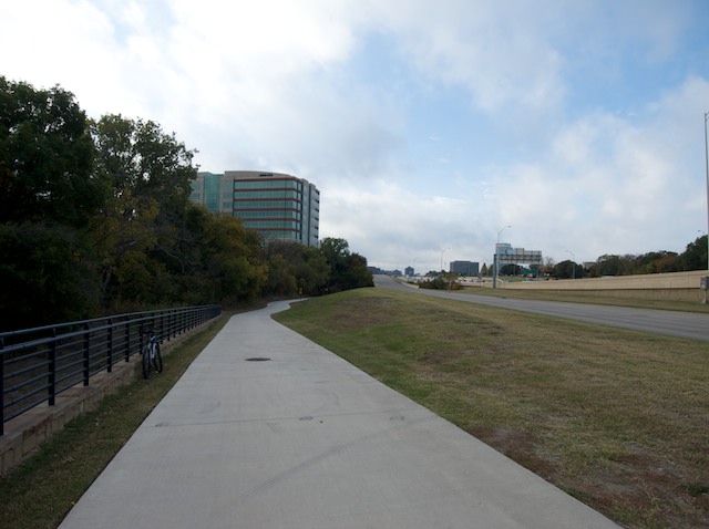 As you exit the park the trail parallels North Central Expressway and its access road.