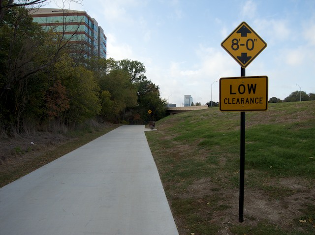 When you cross under the access road bridge you may need to duck if you stand up while peddling.