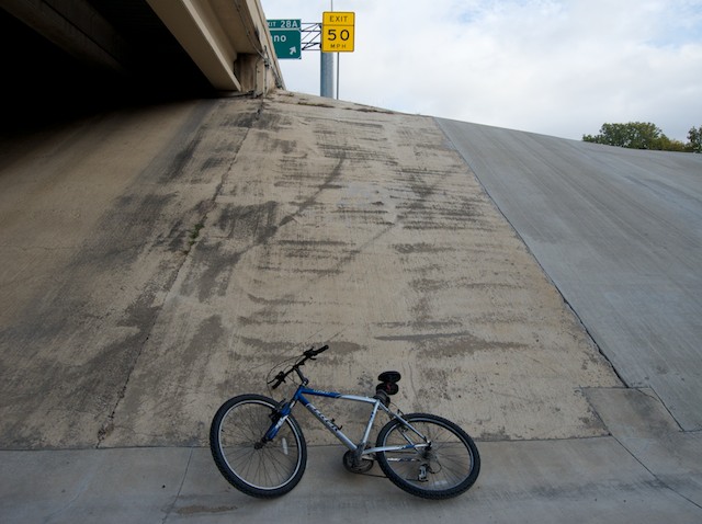 Where the tail passes under North Central Expressway and its access road, you can stop for a while on the erosion control slope. You are now outside of the park. Stay off the expressway. Hiking and biking on the expressway is dangerous and illegal.