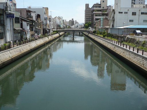 The shipping port of Wakayama City, Japan, is located on the western side of the Kii Peninsula where the Kino River—Kinokawa—meets the Pacific Ocean and the Inland Sea.