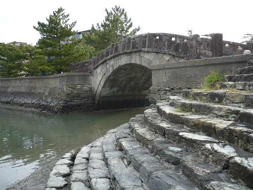 Furobashi bridges arches over a small water outlet to headed to Wakaura Bay.