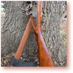 Tomahawk and Pennsylvania Long Rifle icon.