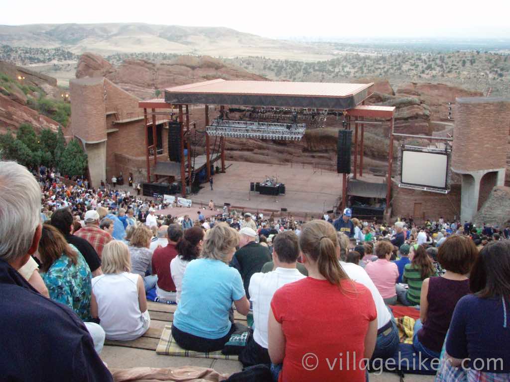 Overview of stage during daylight. Denver is visible in the background.