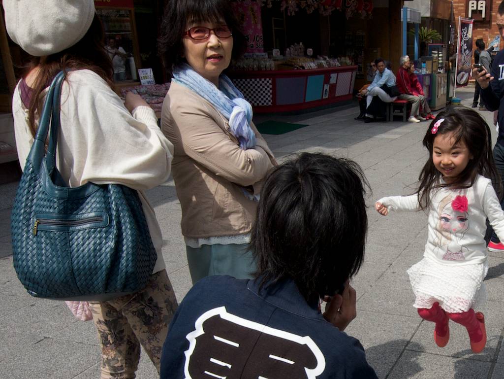 Cute Japanese Girl Jumps for Happiness During Cherry Blossom Season 2013