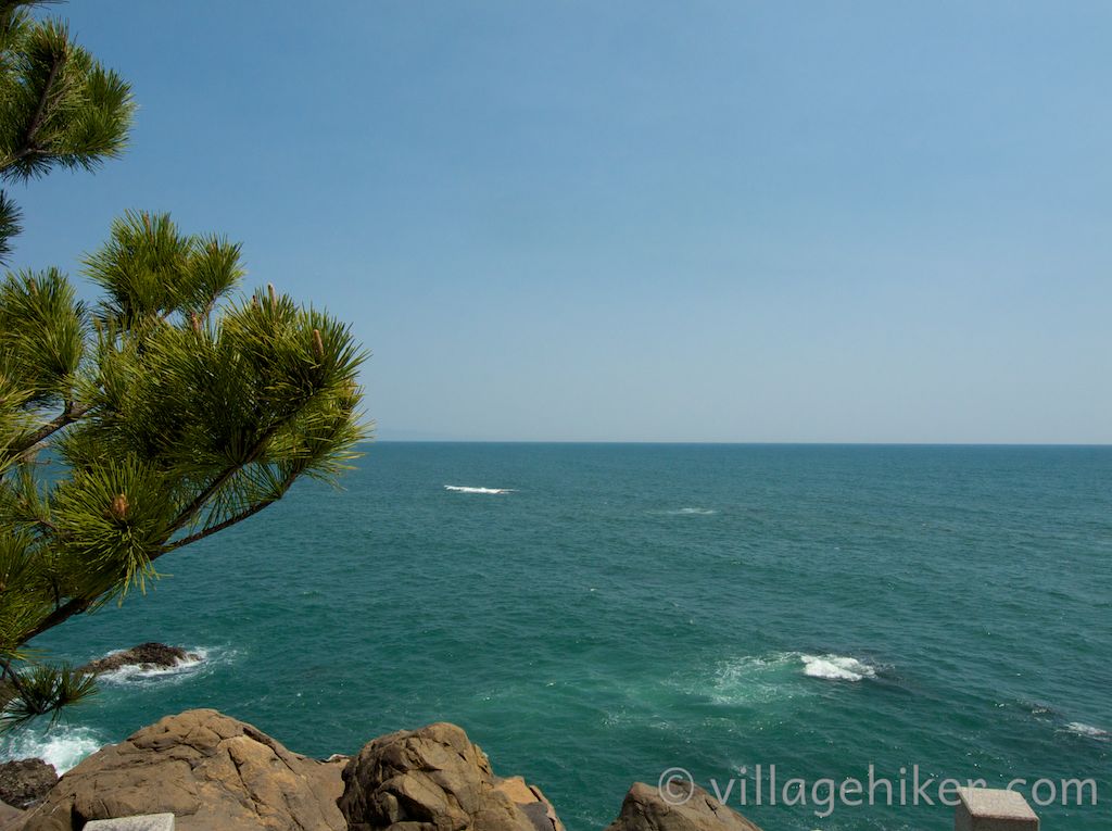 The Pacific Ocean at Katsurahama appears as retouched blue when viewed from Ryūō Point at the southwestern end of the beach.