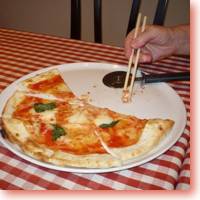 Eating pizza with chopsticks (being silly)