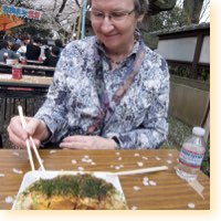 eating okonomiyak at ueno park, tokyo