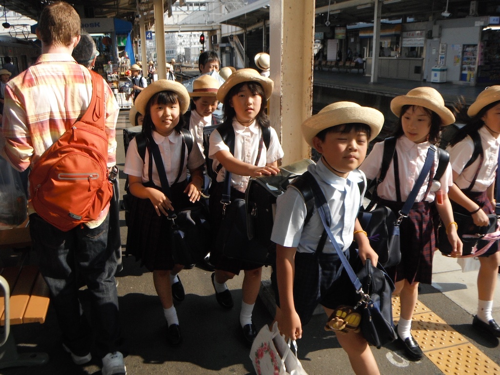 Japanese school children on the go.