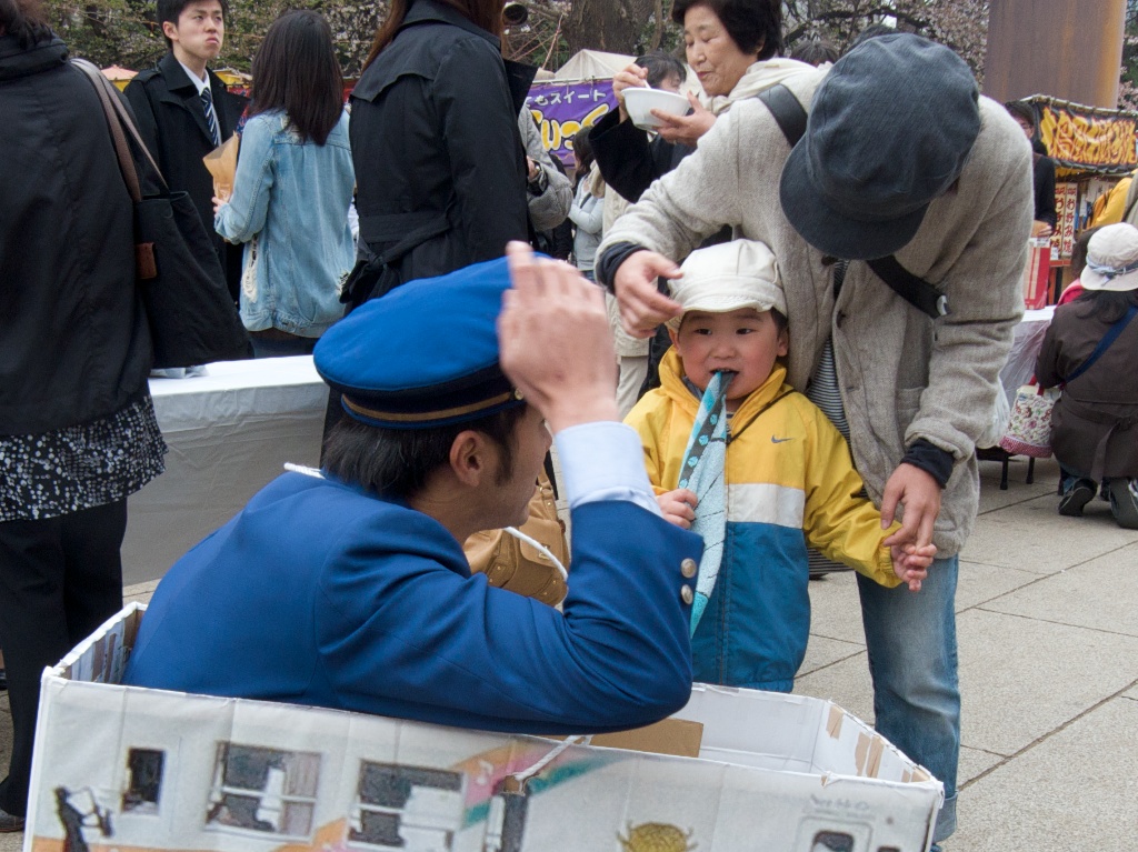 Yasukuni Shine Security Officer Suggesting a Hat Swap