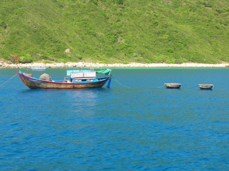 Vietnamese Fishing Boat Towing Two Coracles