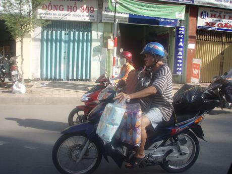 Motorbike loaded with small packages in Ho Chi Minh City, Vietnam